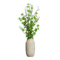 BRANCHE D'ARBRE DANS UN GRAND POT